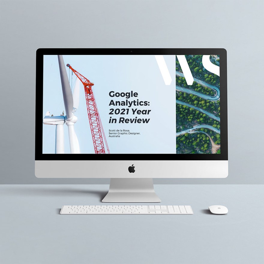 iMac against a soft blue background with my presentation on the screen